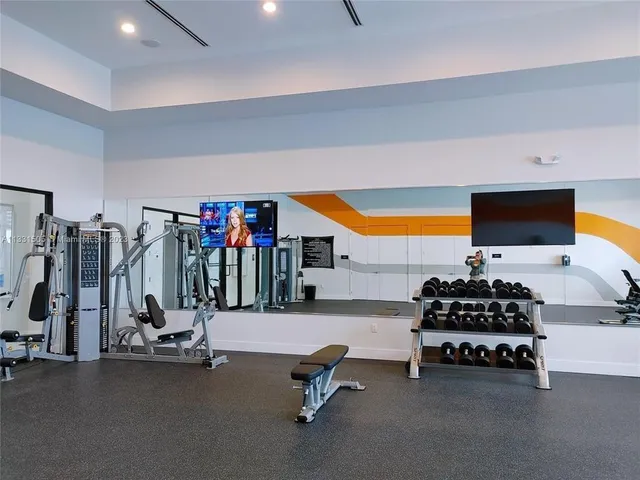 a room with gym equipment and equipment