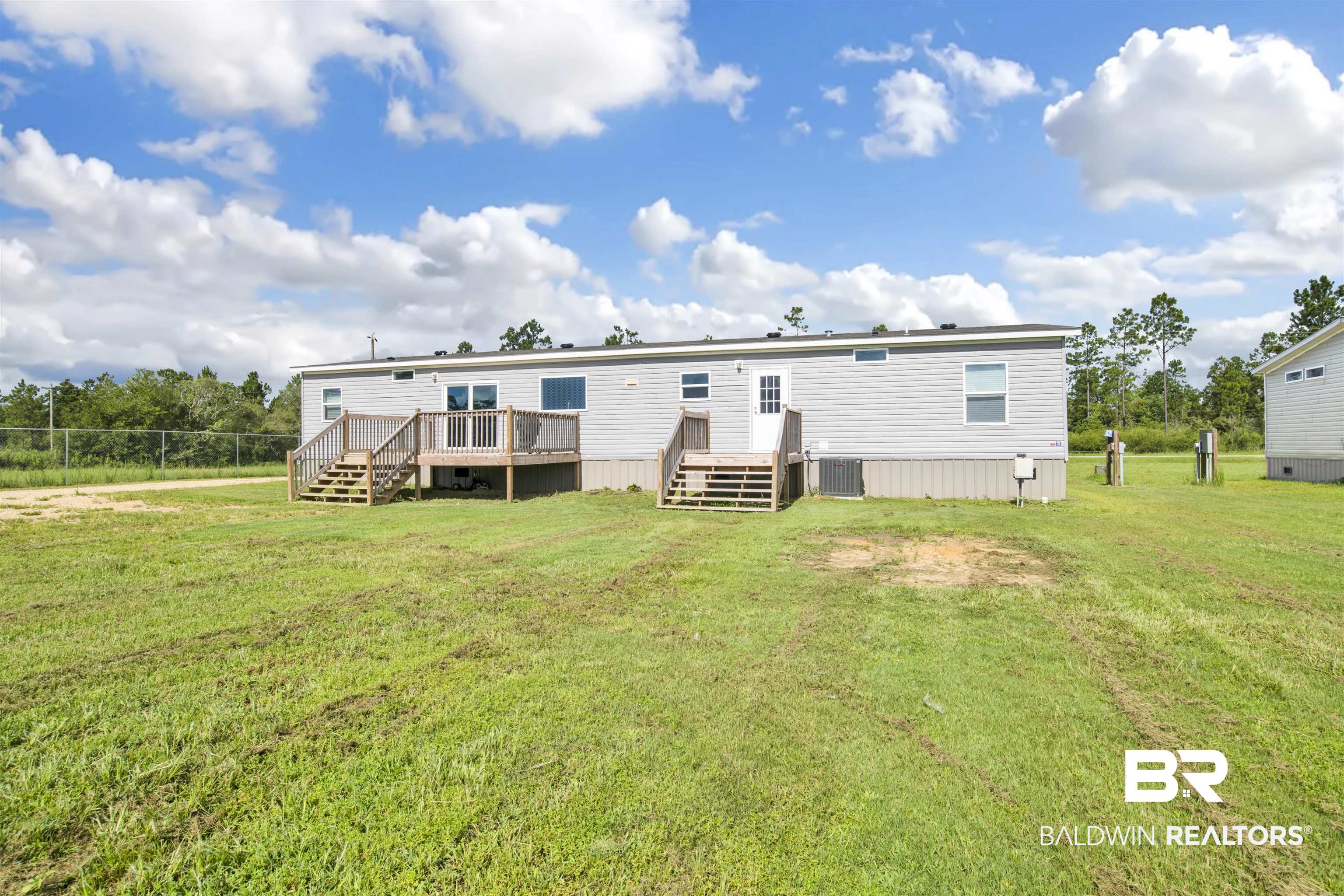 16778 County Road 87 Elberta, AL 36530 - Photo 7 of 32 Back of property featuring a deck, cooling unit, and a yard