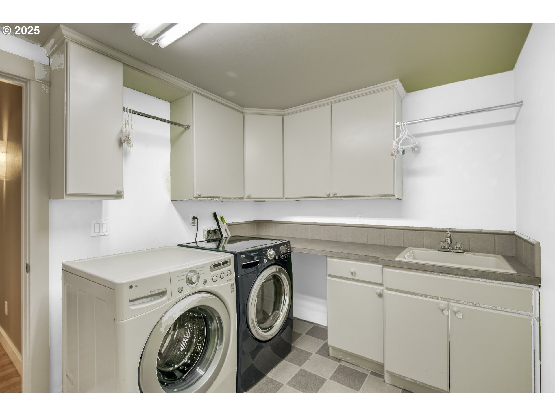 11540 Southwest 58th Court Portland, OR 97219 - Photo 16 of 33 a utility room with sink dryer and washer