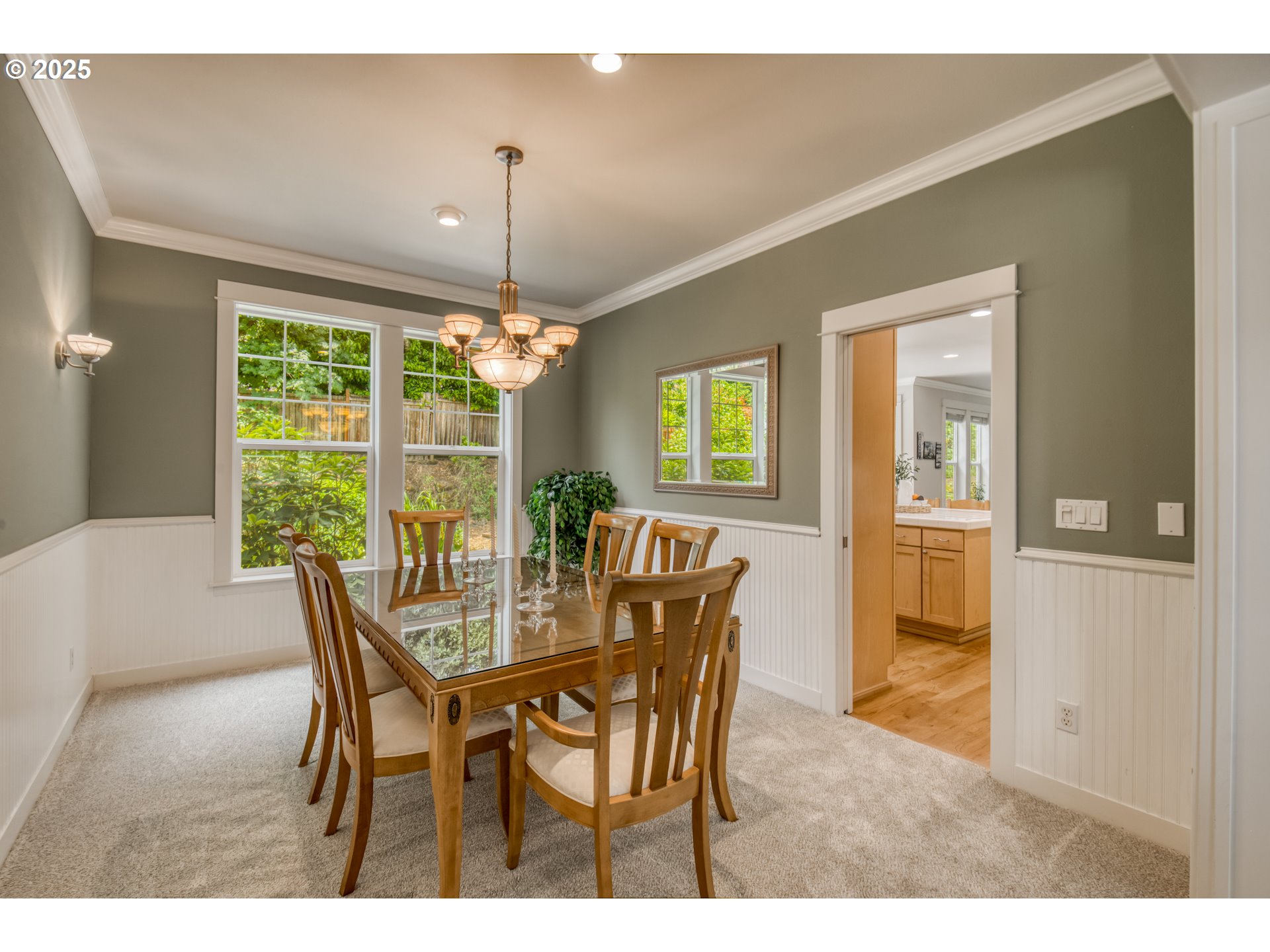 11540 Southwest 58th Court Portland, OR 97219 - Photo 7 of 33 a dining room with furniture a chandelier and wooden floor