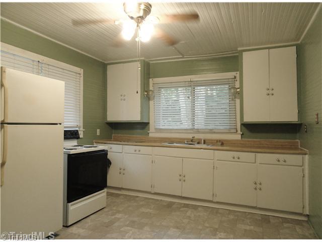 3360 Valley Road Winston-Salem, NC 27106 - Photo 5 of 15 Kitchen. The eat-in kitchen offers plenty of shelving.