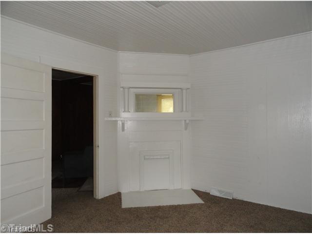 3360 Valley Road Winston-Salem, NC 27106 - Photo 7 of 15 Master Bedroom. beaded board paneling in the master bedroom and mantle over nonfunctional fireplace