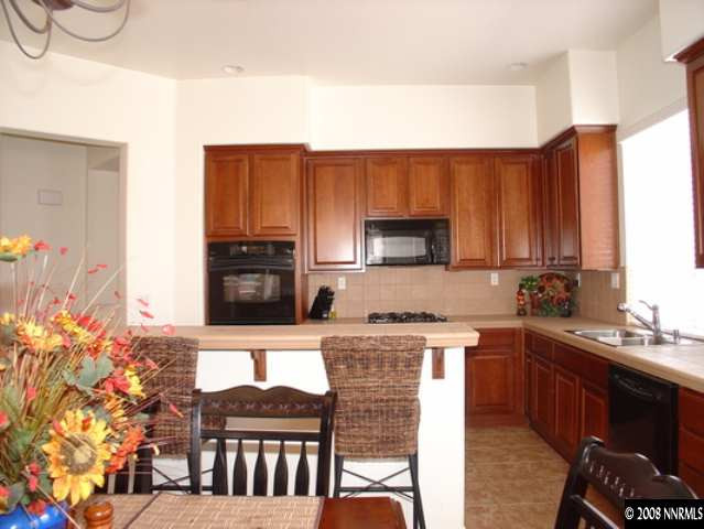 10694 Autumn Walk Lane Reno, NV 89521 - Photo 3 of 9 a kitchen with a sink cabinets and appliances