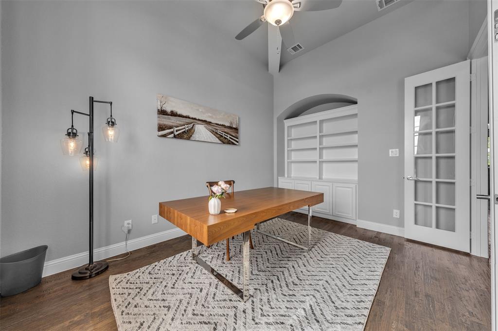 1060 Waters Edge Court Oak Point, TX 75068 - Photo 6 of 40 a living room with furniture and a chandelier
