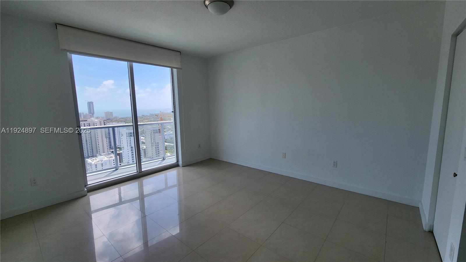 185 Southwest 7th Street, Unit 3814 Miami, FL 33130 - Photo 6 of 17 Spacious bedroom with amazing water and city open views, and door to balcony