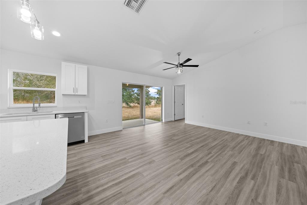 7 Walnut Place Ocala, FL 34480 - Photo 12 of 39 an empty room with windows and cabinet