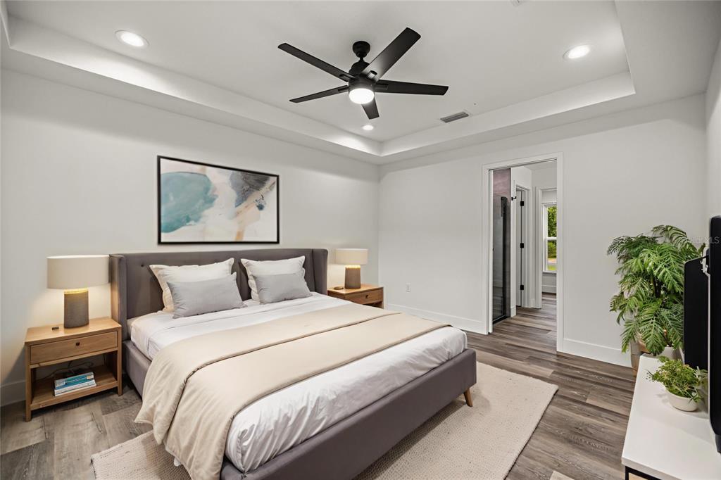 7 Walnut Place Ocala, FL 34480 - Photo 17 of 39 a bedroom with a bed and a potted plant