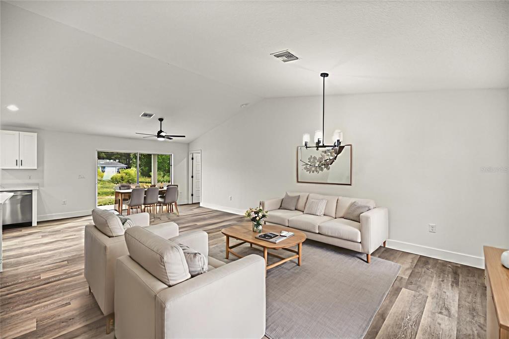 7 Walnut Place Ocala, FL 34480 - Photo 3 of 39 a living room with furniture and a wooden floor