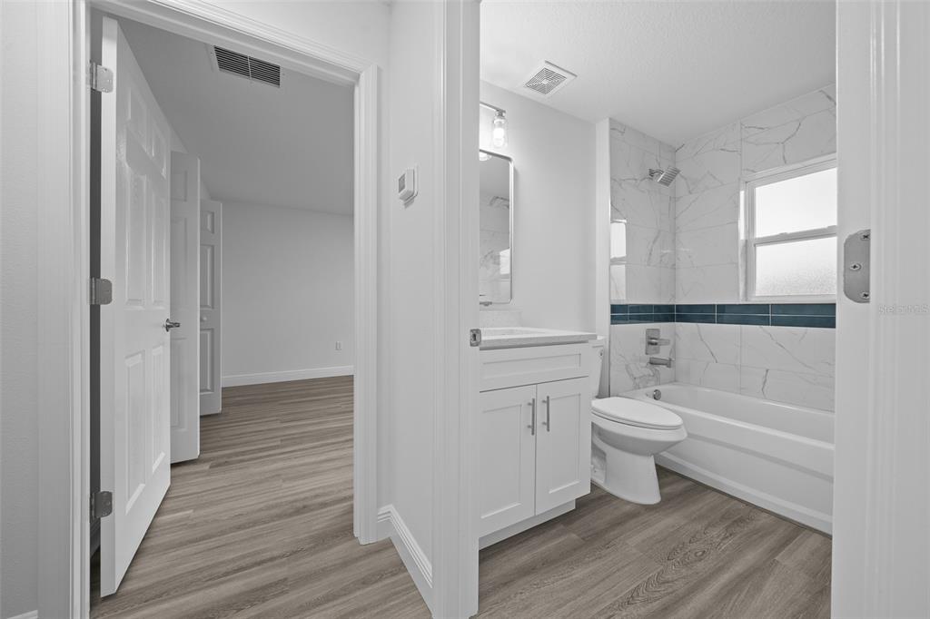 7 Walnut Place Ocala, FL 34480 - Photo 34 of 39 a bathroom with a toilet a sink and bathtub