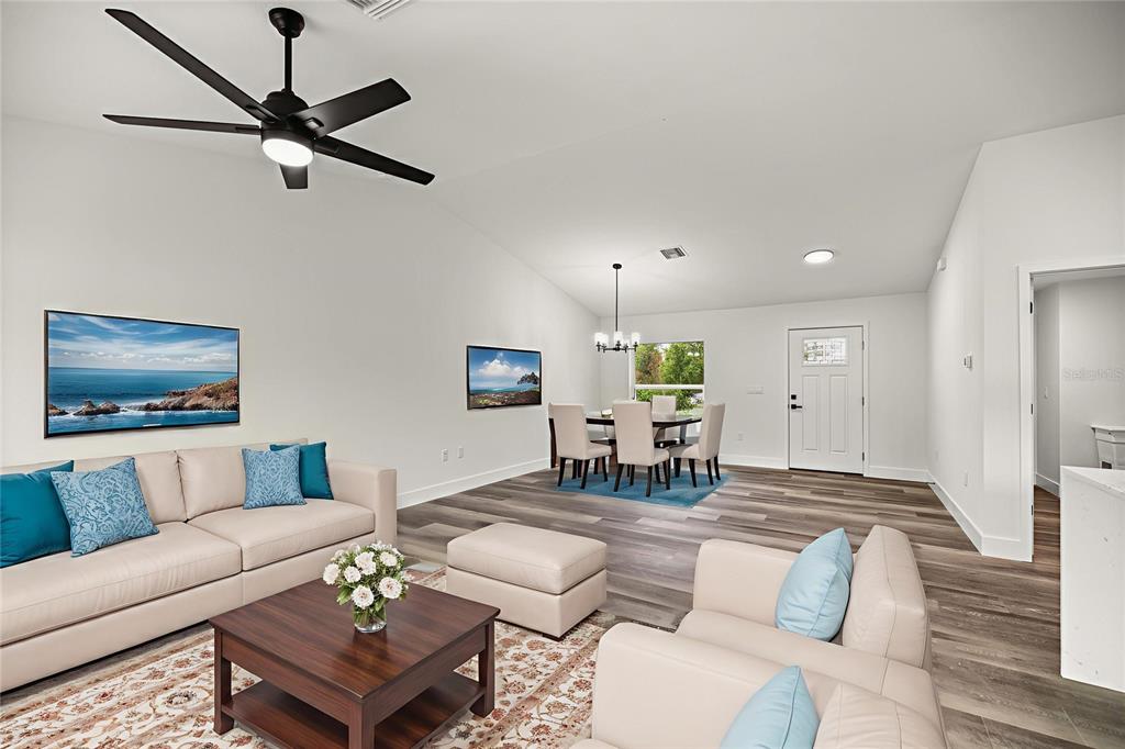 7 Walnut Place Ocala, FL 34480 - Photo 7 of 39 a living room with furniture and a wooden floor