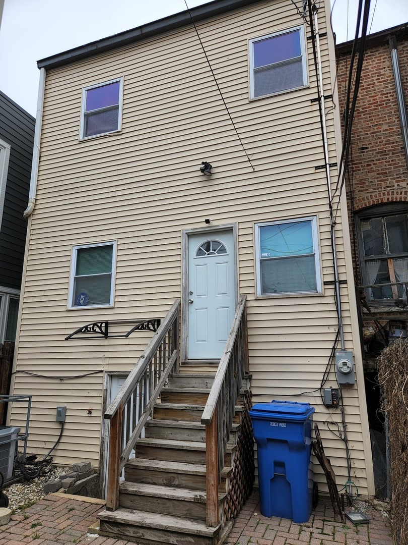 2663 West Maypole Avenue Chicago, IL 60612 - Photo 14 of 15 a view of a house with wooden stairs