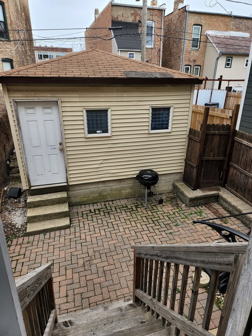 2663 West Maypole Avenue Chicago, IL 60612 - Photo 15 of 15 a backyard of a house