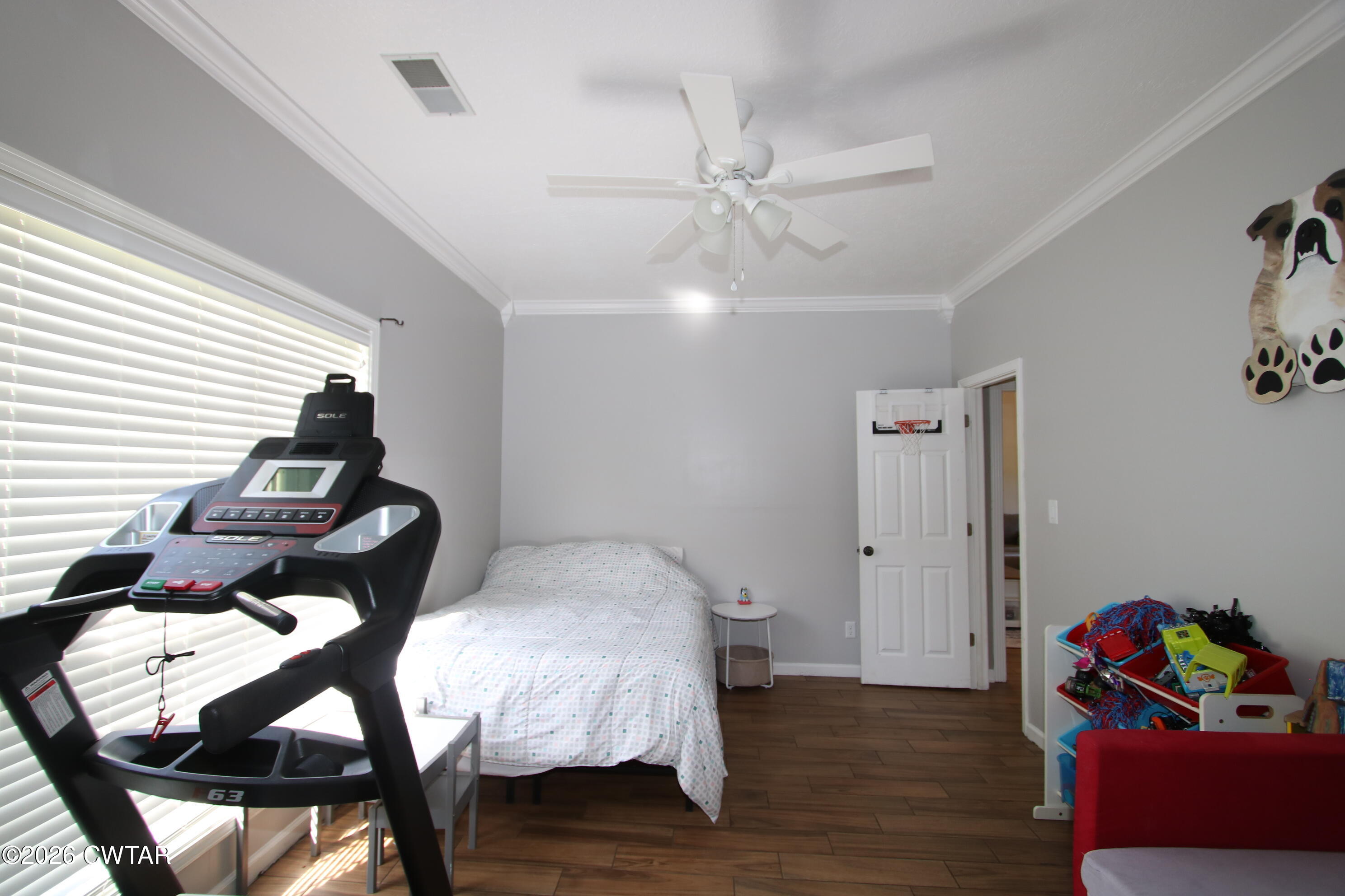 98 Browning Road Milan, TN 38358 - Photo 40 of 60 a bedroom with furniture and wooden floor