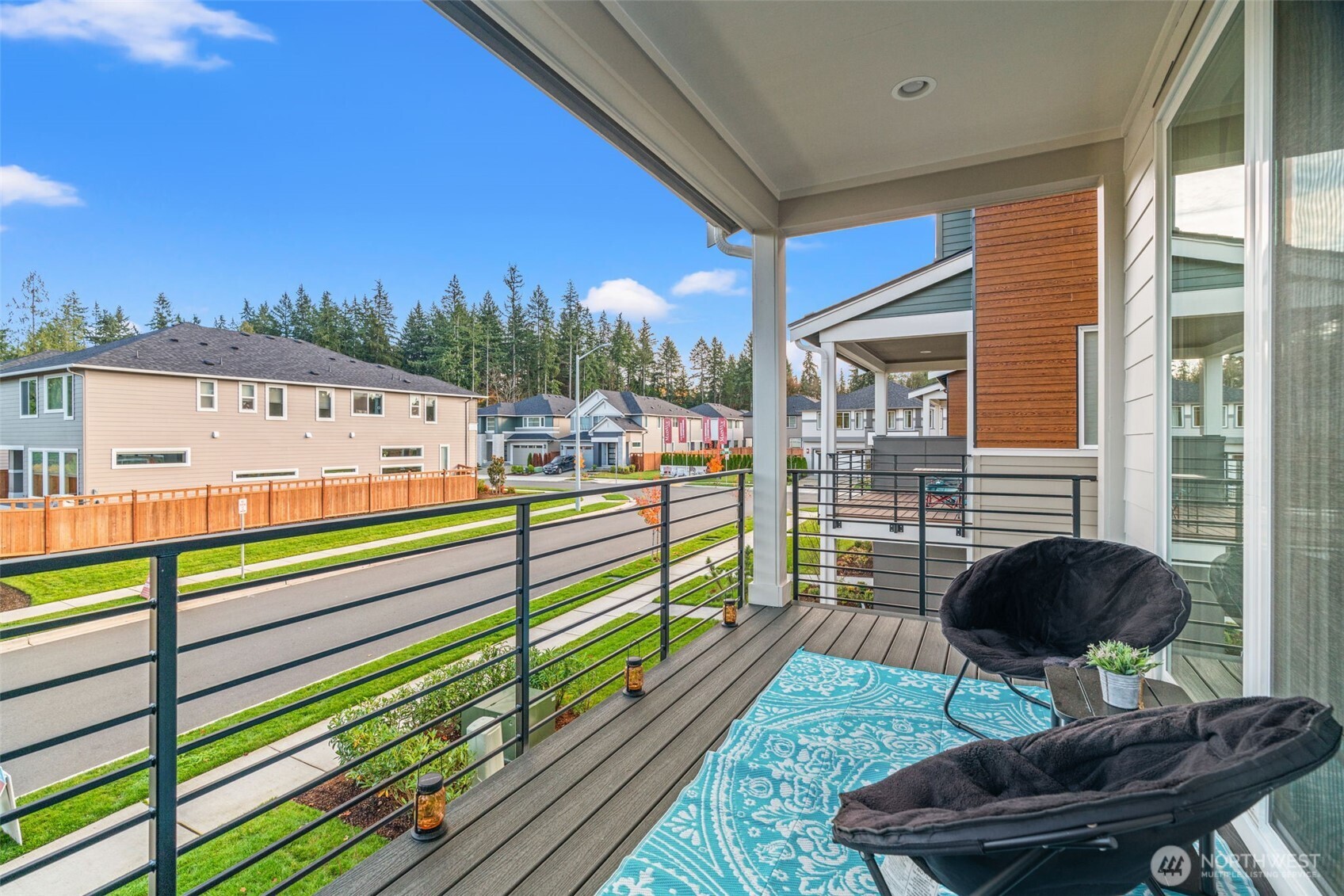 3915 198th Street Southeast, Unit F4 Bothell, WA 98012 - Photo 15 of 38 a view of a balcony with floor to ceiling windows with wooden floor
