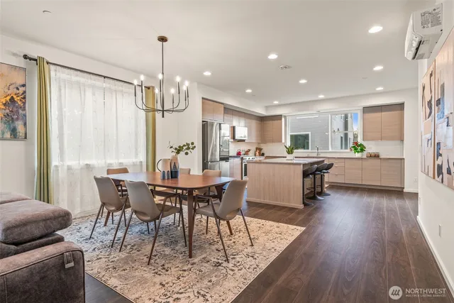 a view of a dining room with furniture window and wooden floor