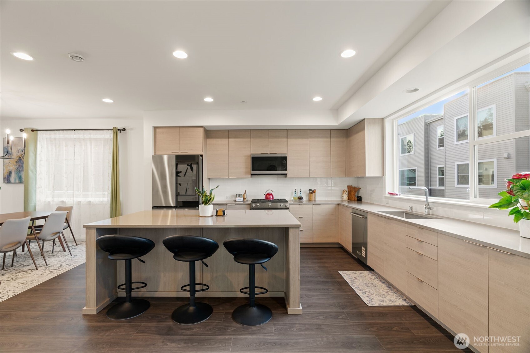 3915 198th Street Southeast, Unit F4 Bothell, WA 98012 - Photo 23 of 38 a kitchen with sink cabinets and dining table
