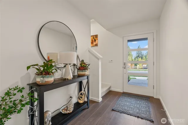 a room with table and flowerpot