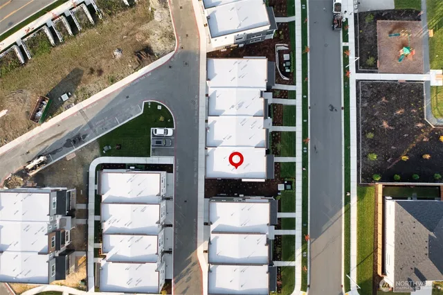 an outdoor space with seating area and city view