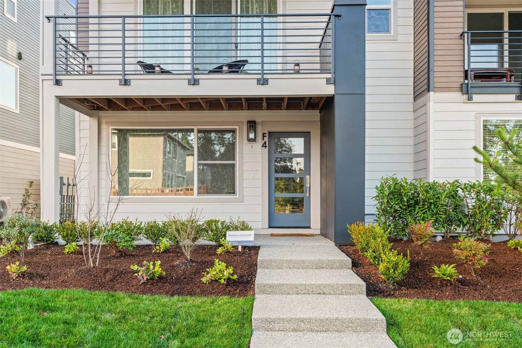 3915 198th Street Southeast, Unit F4 Bothell, WA 98012 - Photo 5 of 38 a front view of a house with a yard