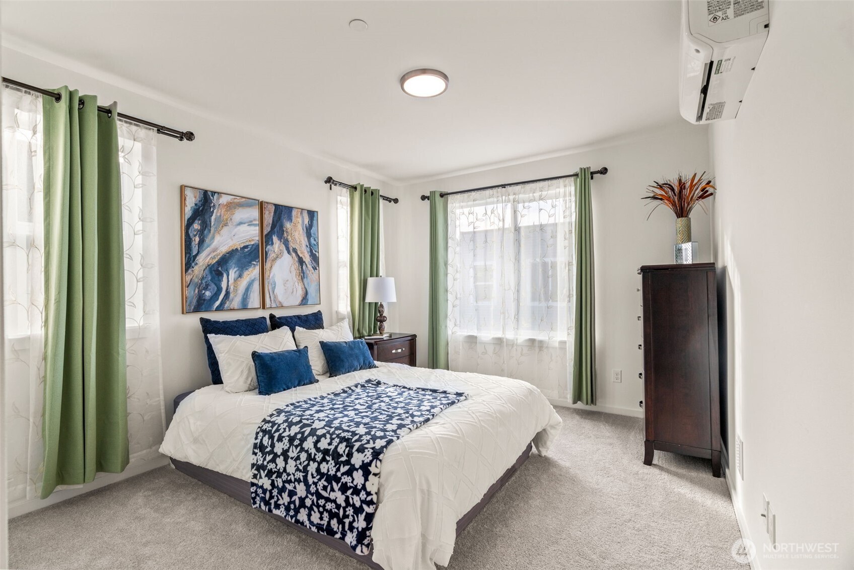 3915 198th Street Southeast, Unit F4 Bothell, WA 98012 - Photo 7 of 38 a bedroom with a large bed and a window