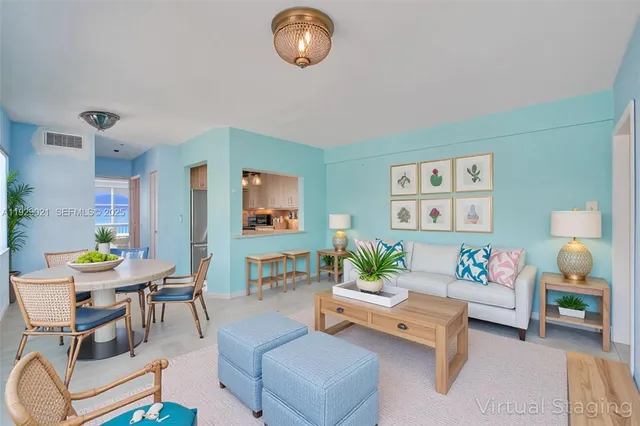 a living room with furniture and a table