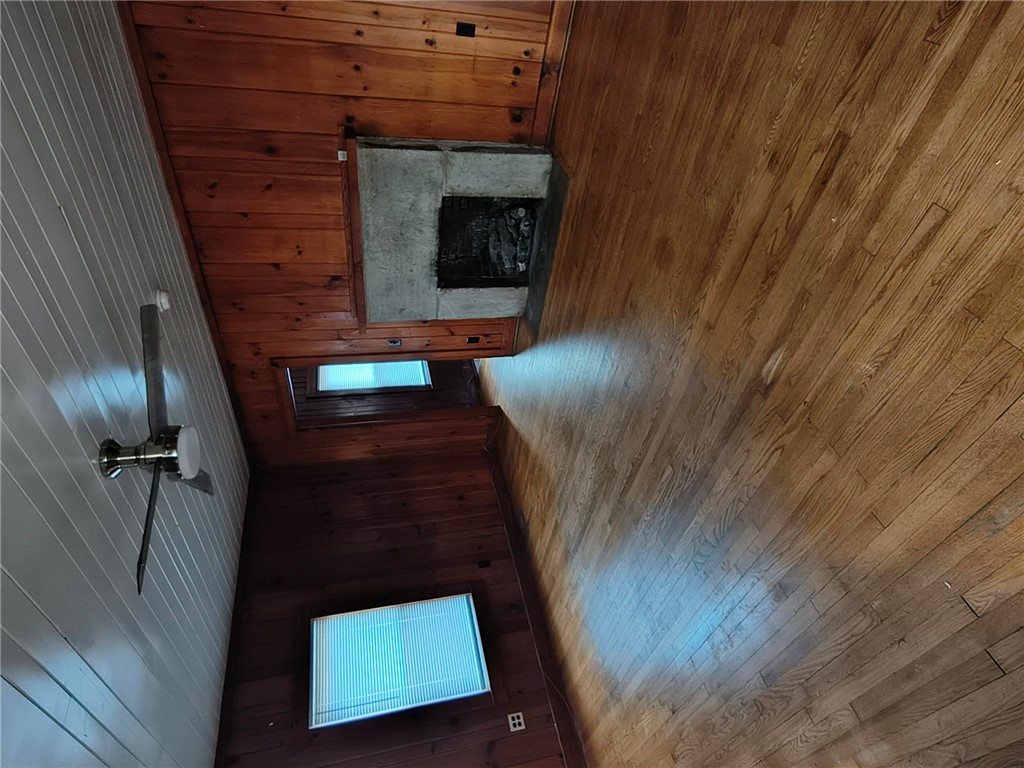 346 Clemson Street Clemson, SC 29631 - Photo 2 of 8 Hardwood floors and a rustic fireplace create a cozy atmosphere in this welcoming space.
