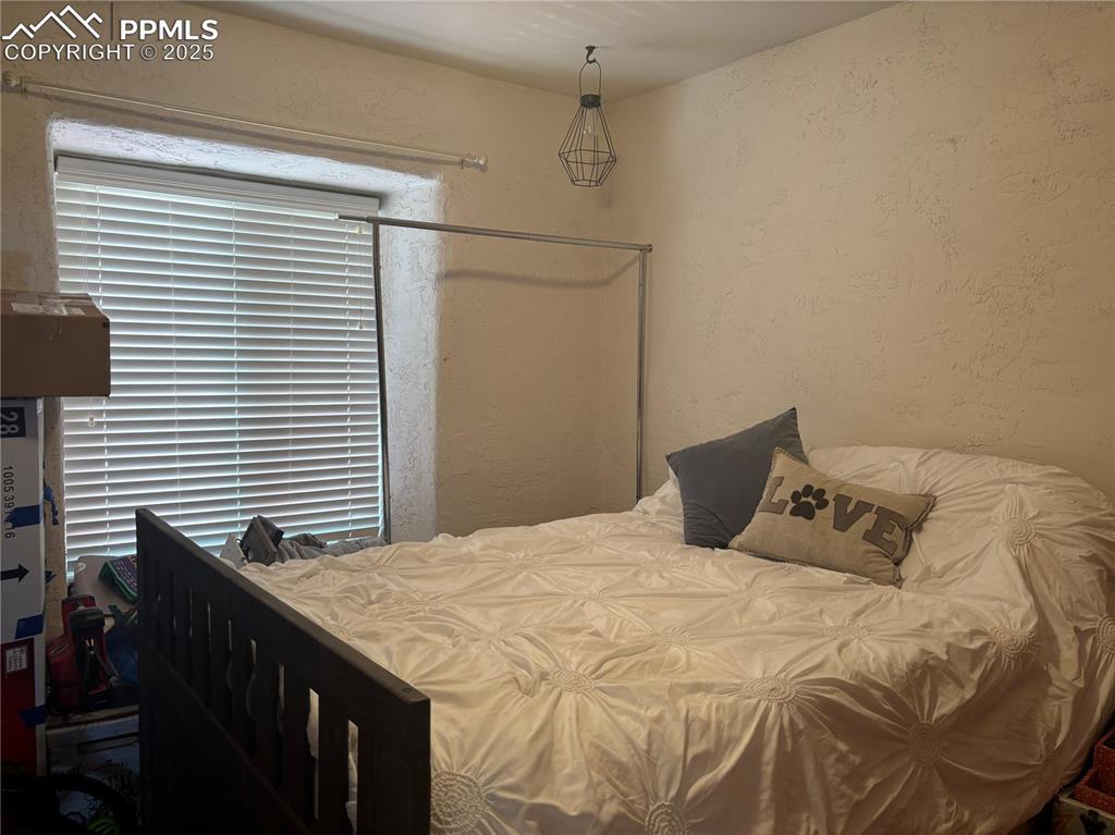 201 Terry Lane Guffey, CO 80820 - Photo 12 of 25 a bedroom with a bed and a window