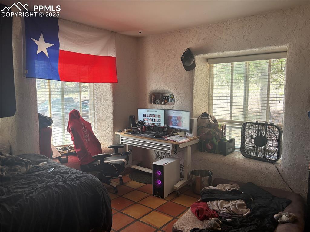 201 Terry Lane Guffey, CO 80820 - Photo 13 of 25 a bed room with a bed and a window