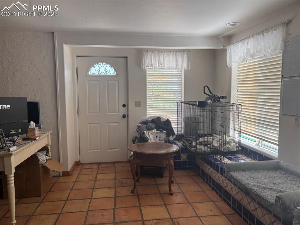 201 Terry Lane Guffey, CO 80820 - Photo 2 of 25 a living room with furniture and a flat screen tv