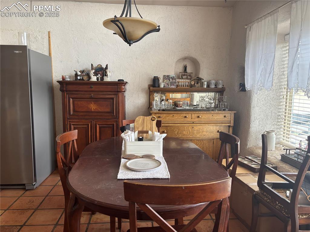 201 Terry Lane Guffey, CO 80820 - Photo 4 of 25 a dining room with furniture a chandelier and wooden floor