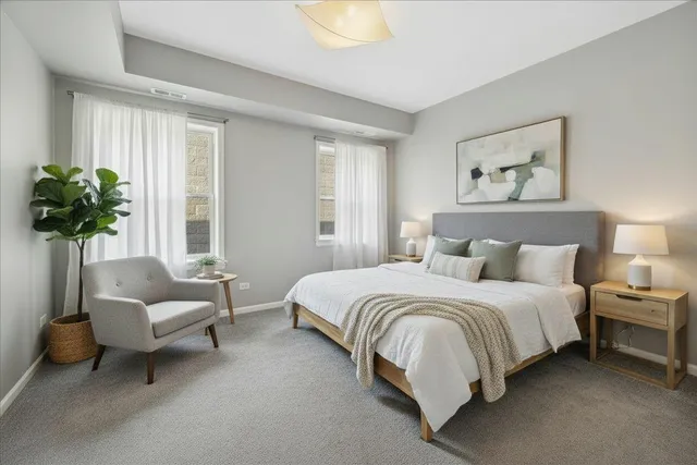 a spacious bedroom with a bed and a couch