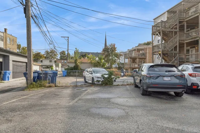 a view of cars parked in a parking lot