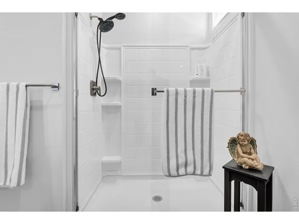 a bathroom with a granite countertop sink a toilet and a mirror