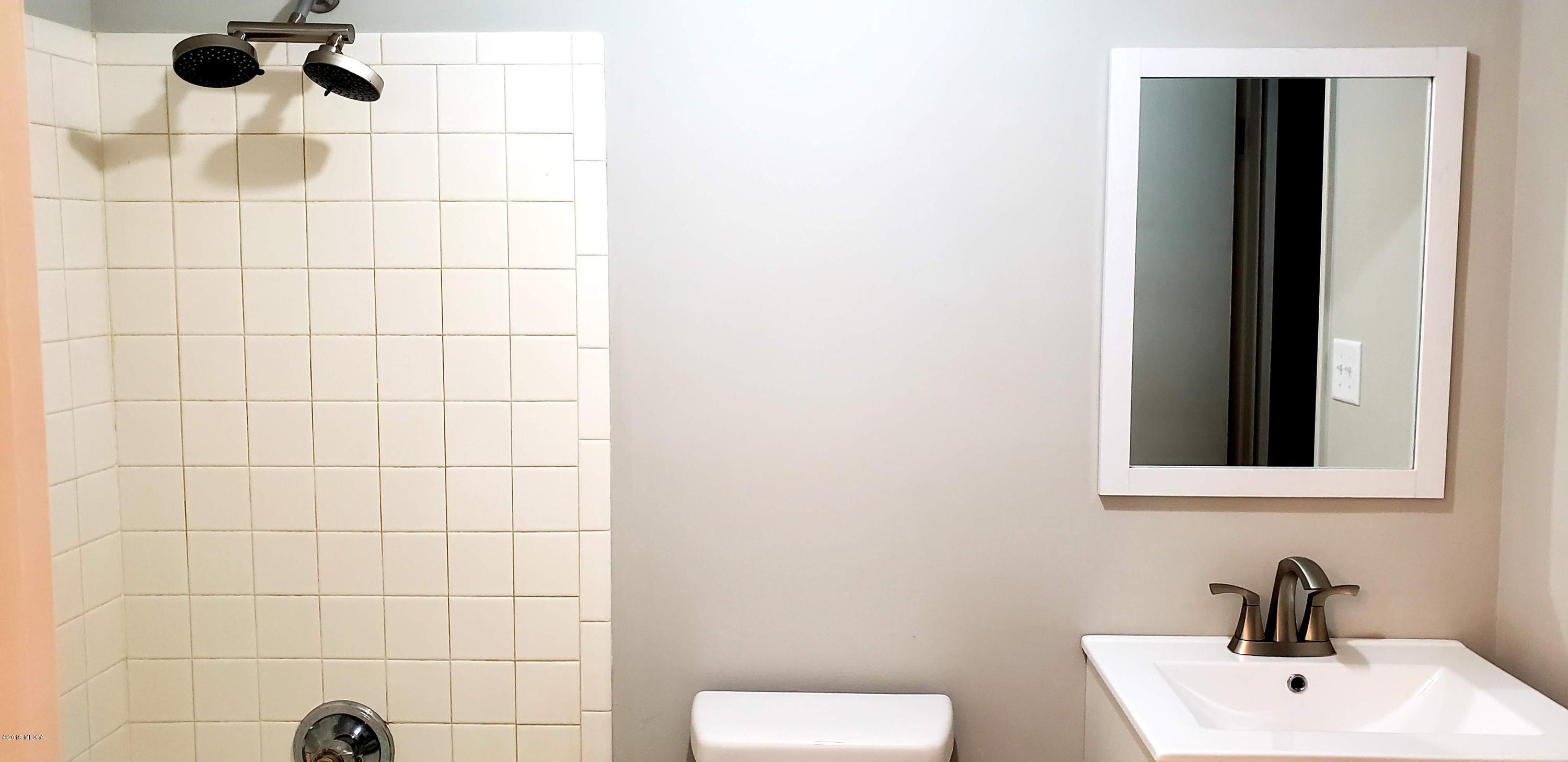 259 Greenwood Road Gray, GA 31032 - Photo 15 of 29 a bathroom with a sink and a mirror