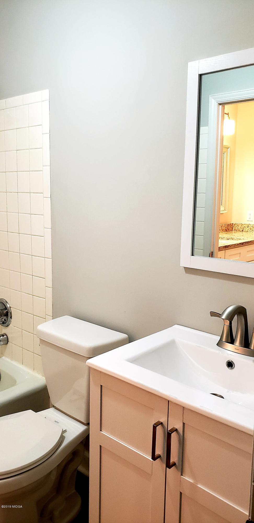 259 Greenwood Road Gray, GA 31032 - Photo 16 of 29 a bathroom with a sink a toilet and a mirror