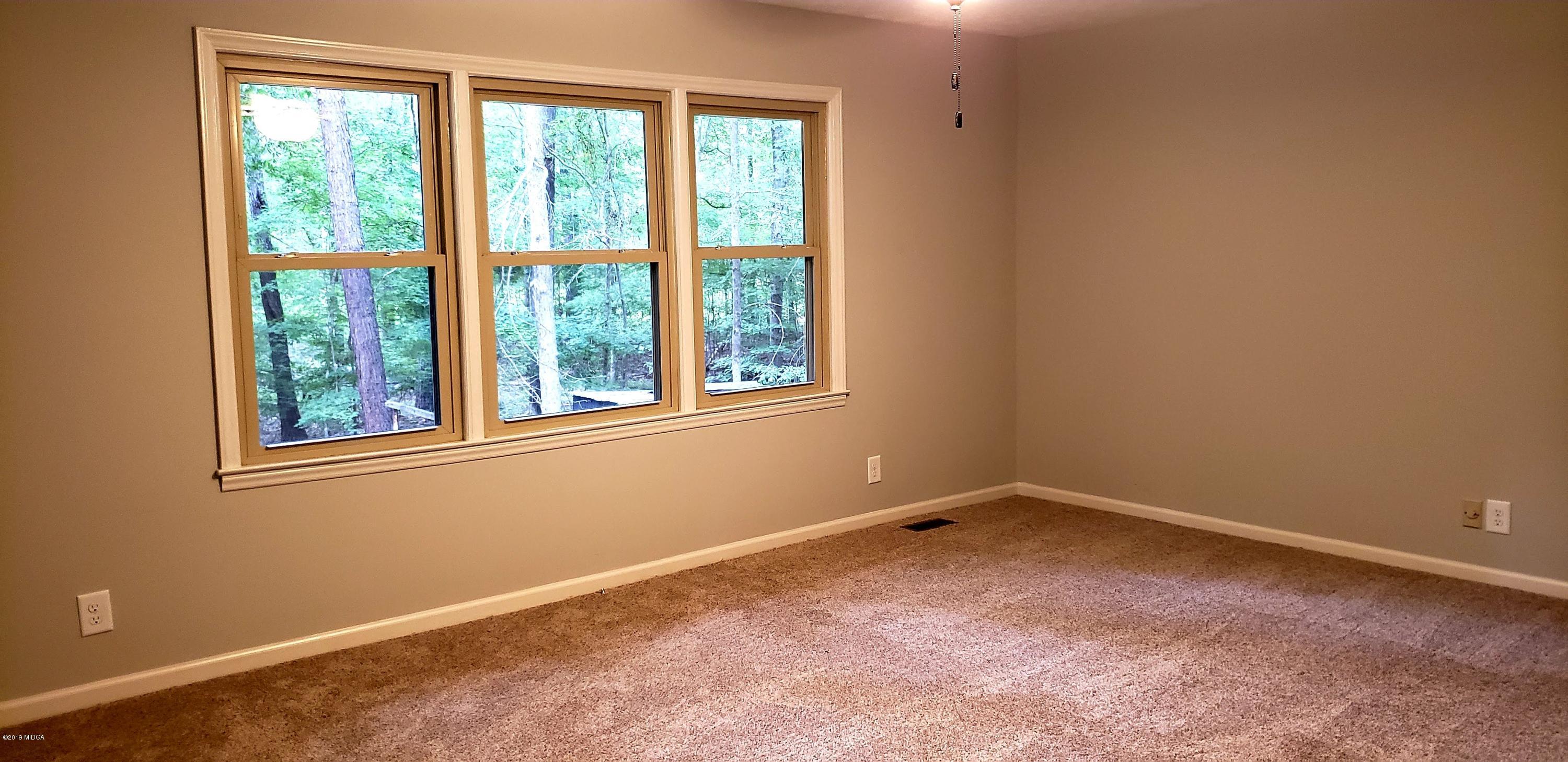 259 Greenwood Road Gray, GA 31032 - Photo 17 of 29 an empty room with a window
