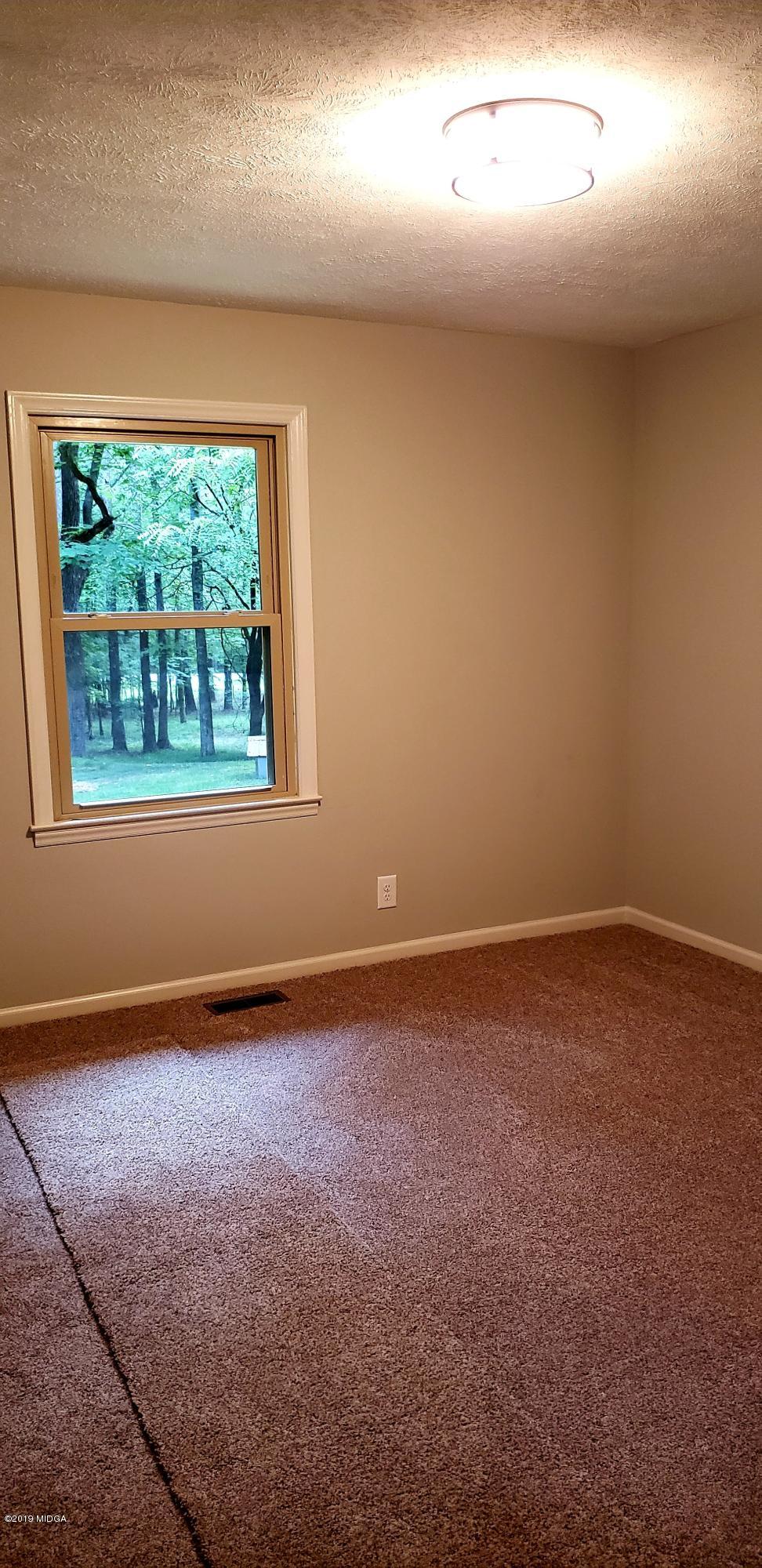 259 Greenwood Road Gray, GA 31032 - Photo 18 of 29 an empty room with a window