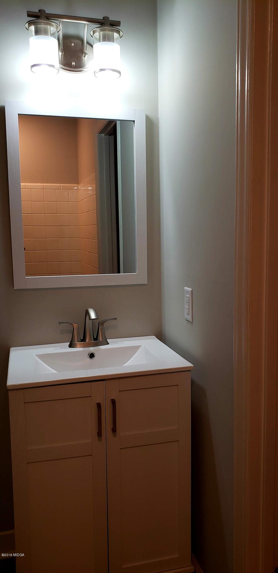 259 Greenwood Road Gray, GA 31032 - Photo 19 of 29 a bathroom with a sink and a mirror