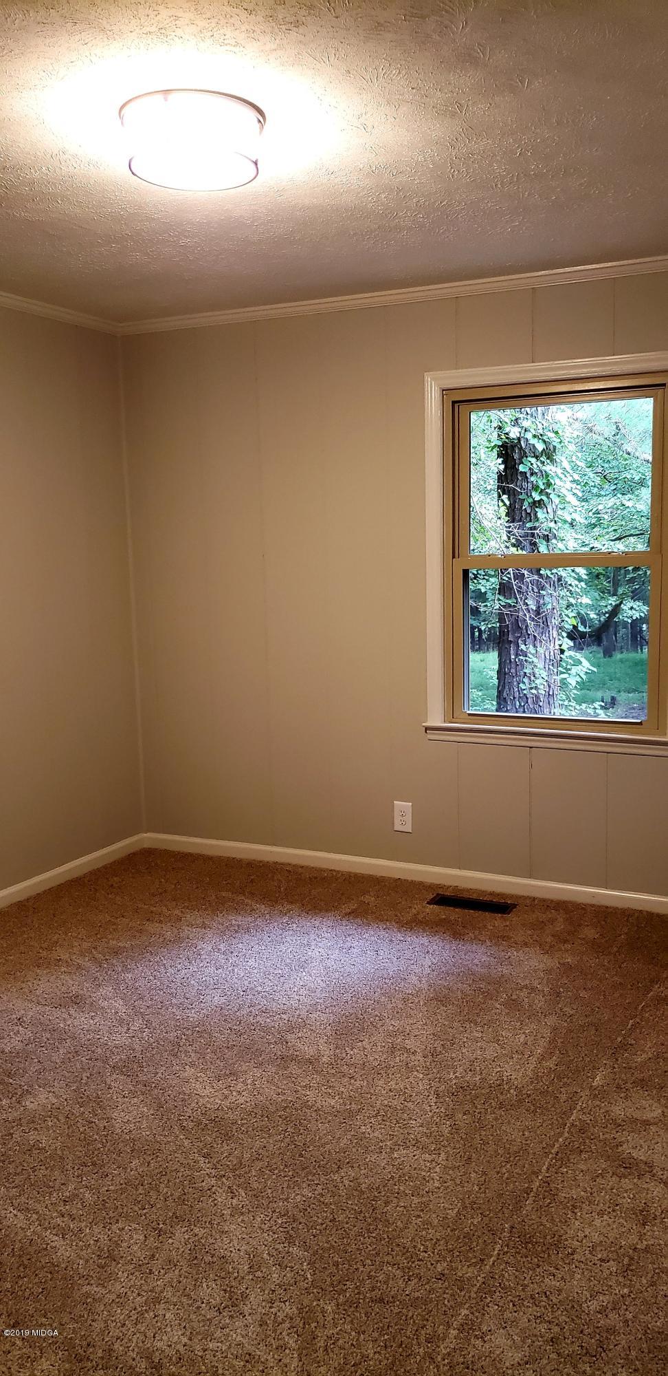 259 Greenwood Road Gray, GA 31032 - Photo 21 of 29 en empty room with windows