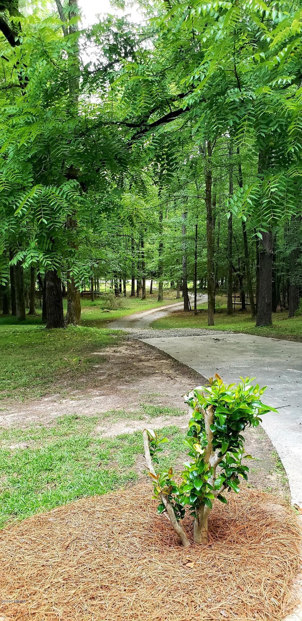 259 Greenwood Road Gray, GA 31032 - Photo 28 of 29 a childrens park with lots of trees and plants