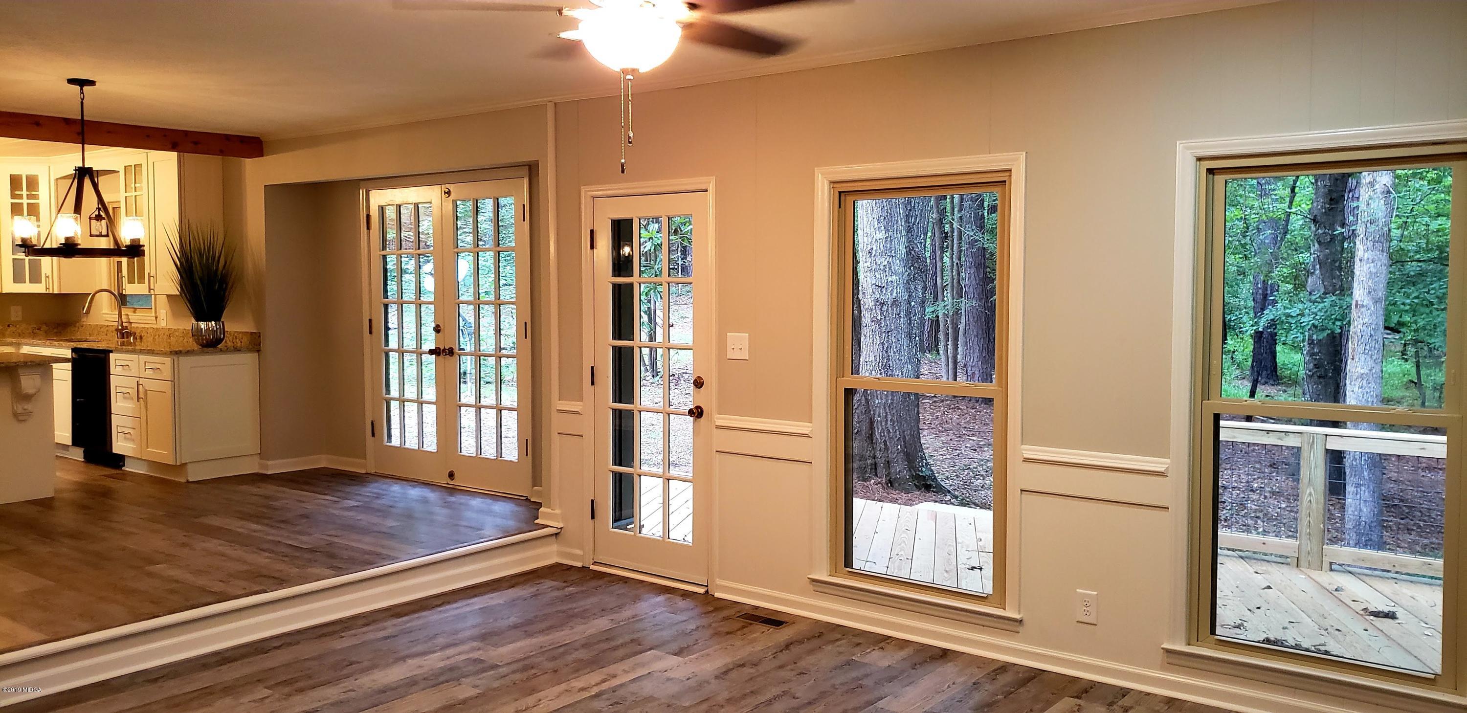 259 Greenwood Road Gray, GA 31032 - Photo 4 of 29 a view of an entryway with wooden floor and door