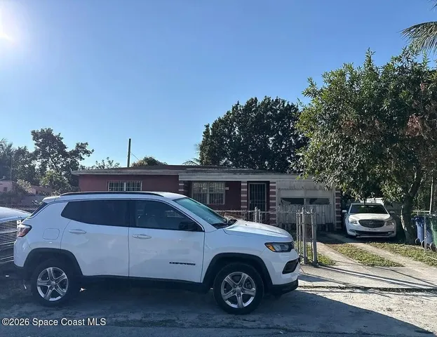 a car parked in front of a house