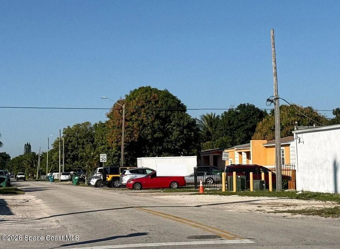 760 Northwest 147th Street Miami, FL 33168 - Photo 5 of 5 a view of street along with parked cars