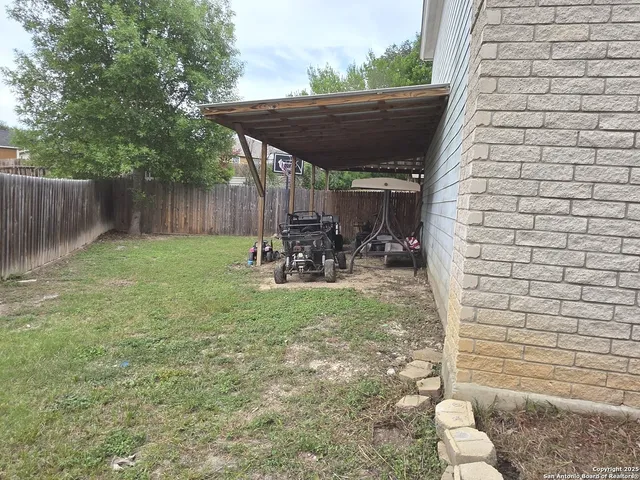 a view of back yard of the house