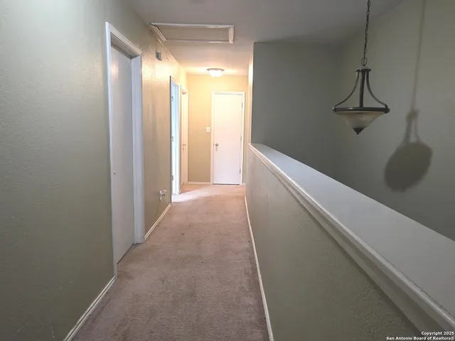 a view of hallway with shower
