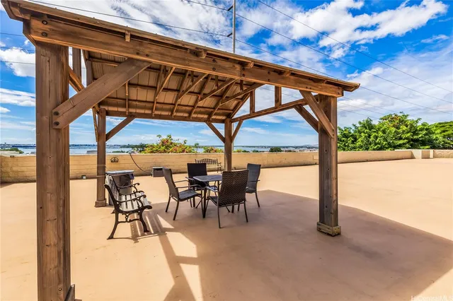 a patio with table and chairs
