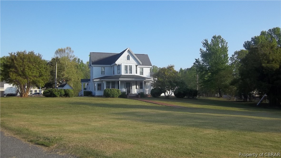 705 Greys Point Road Topping, VA 23169 - Photo 1 of 46 View of front of property with a front lawn