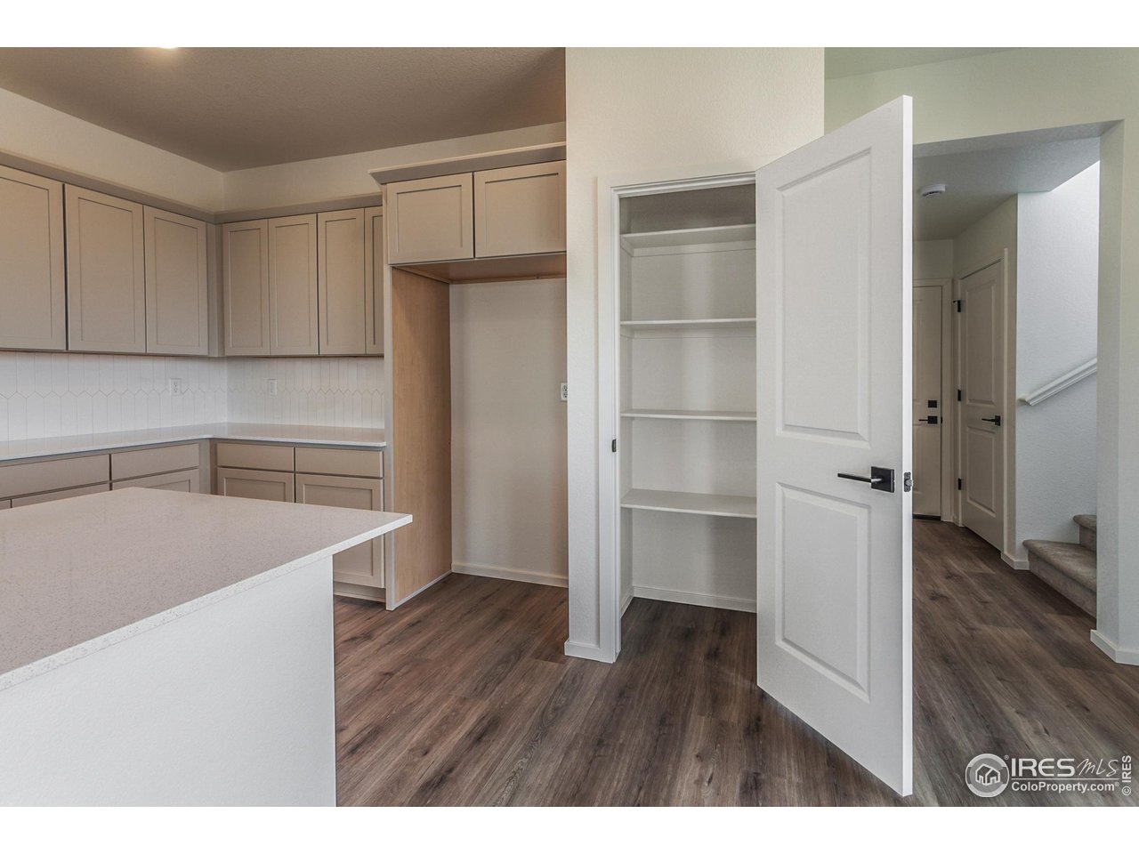 5701 Stone Fly Drive Timnath, CO 80547 - Photo 16 of 48 a kitchen with a refrigerator and a sink