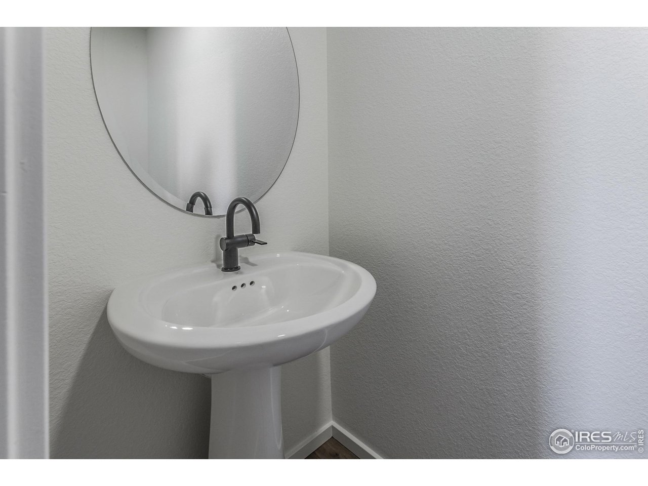 5701 Stone Fly Drive Timnath, CO 80547 - Photo 20 of 48 a sink with a mirror