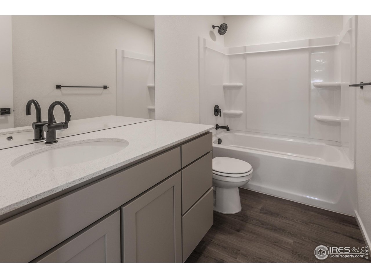 5701 Stone Fly Drive Timnath, CO 80547 - Photo 25 of 48 a bathroom with a sink a toilet and a bathtub